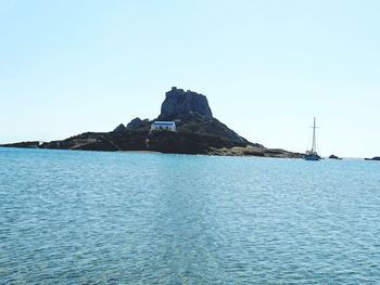 View of calm blue sea against clear sky