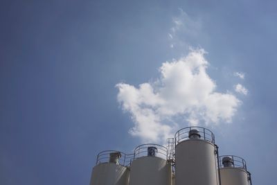 Low angle view of smoke stack against sky