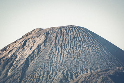 Scenic view of volcanic mountain against clear sky