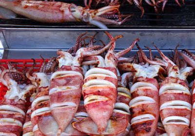 Close-up of grilled squids for sale