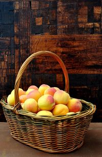 Fruits in basket on table