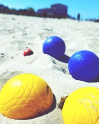 Close-up of colorful umbrellas on sandy beach