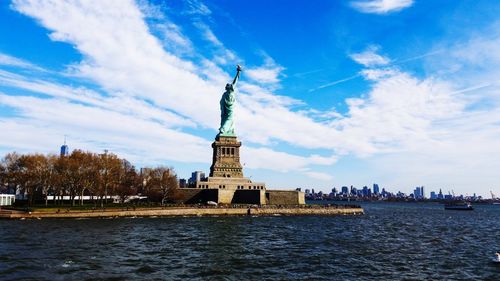 Statue of liberty with city in background