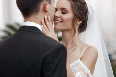 Midsection of couple holding hands