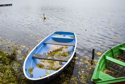 Old wooden boats near the beach of trakai gavle lake , lithuania. autumn and fall time.