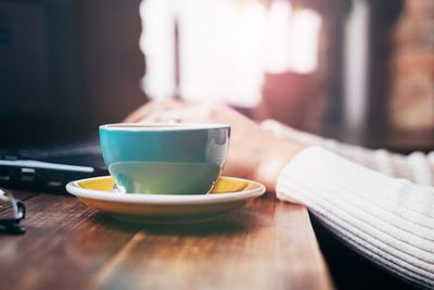 Close-up of coffee cup on table