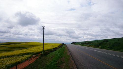 Road passing through field