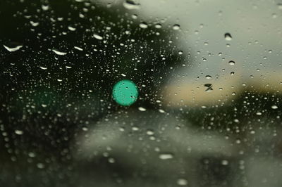 Full frame shot of raindrops on water