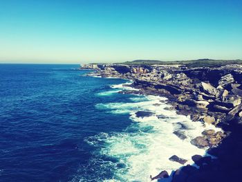 Scenic view of sea against blue sky