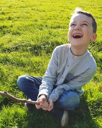 Smiling boy on field