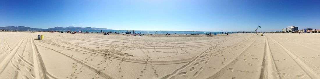 Panoramic view of beach against clear sky