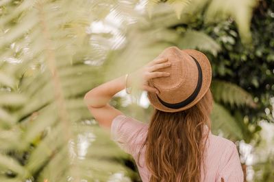 Rear view of woman wearing hat