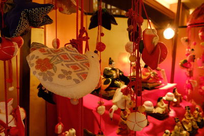 Close-up of illuminated lanterns hanging for sale in market