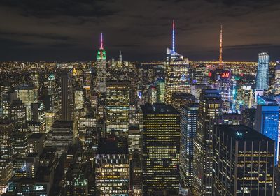 Illuminated buildings in city at night