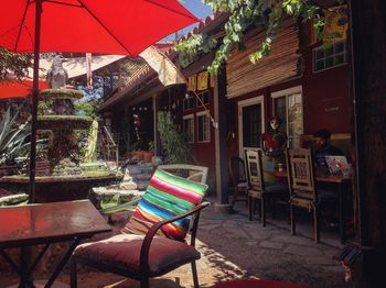 Multi colored chairs against built structure