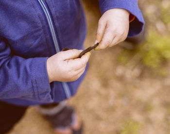 Close-up of man holding hands