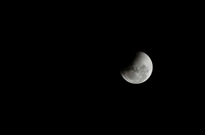 Low angle view of moon against sky at night