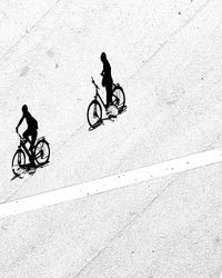 High angle view of man riding bicycle on street