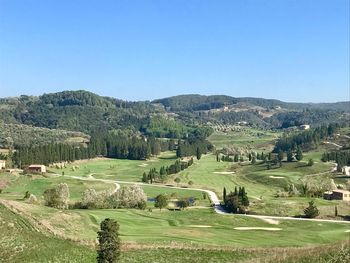 Scenic view of landscape against clear blue sky