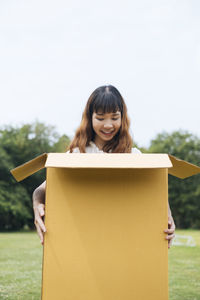 Portrait of a beautiful young woman standing outdoors