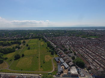 High angle view of road by buildings against sky