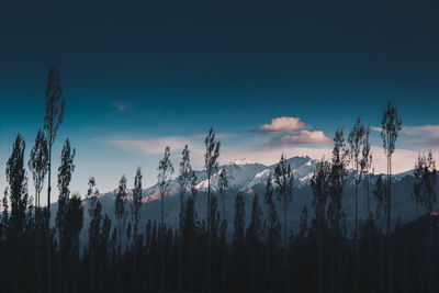 Panoramic view of snowcapped mountains against sky during sunset