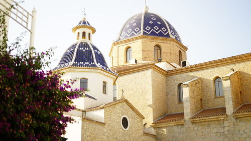 Low angle view of bell tower against sky