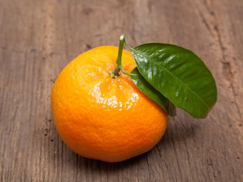 Close-up of orange slices on wooden table