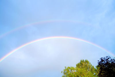 Low angle view of rainbow against sky