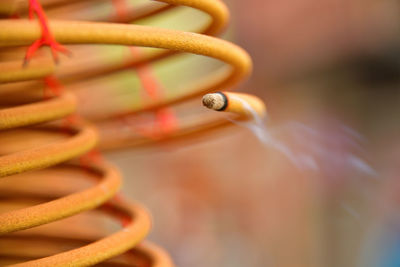 Closeup view of burning incense with smoke