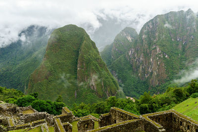 Rocky mountains at machu picchu during foggy weather