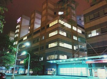 Illuminated buildings in city at night