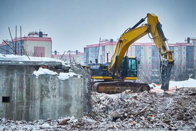 Demolition of old concrete building. hydrohammer crushes building