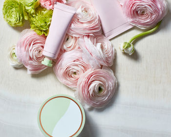 Still life with beauty products and roses