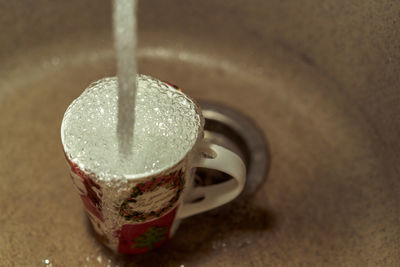 High angle view of coffee cup on table