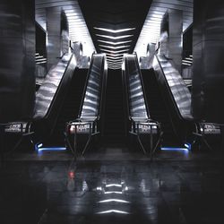 Low angle view of escalators in airport