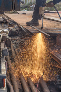 Low angle view of man working at factory