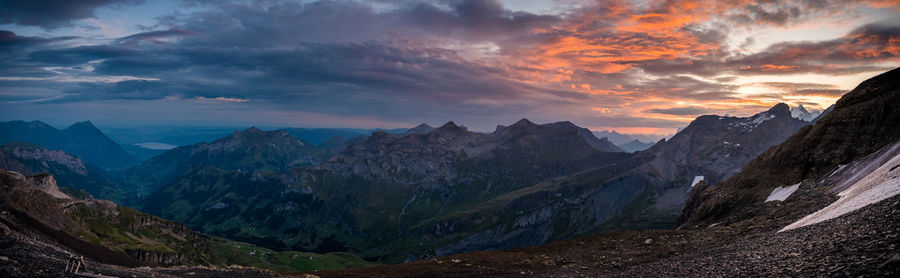 Scenic view of mountains against dramatic sky