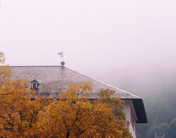 Buildings against sky during autumn