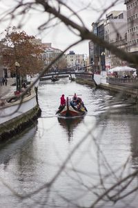 Boat with tourists in canal at city