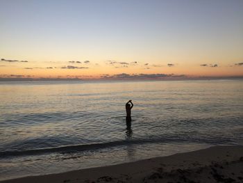 Scenic view of sea at sunset