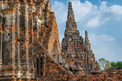 Low angle view of old temple building against sky