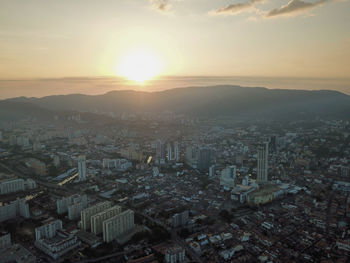 High angle view of townscape against sky during sunset