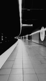 Illuminated underground walkway at night