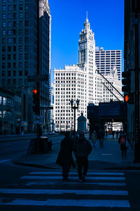 People walking on street in city