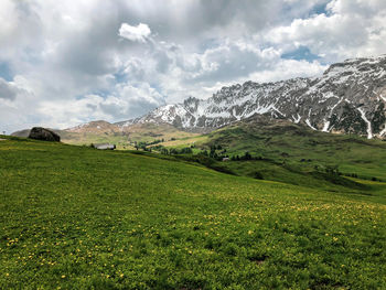 Scenic view of landscape and mountains against sky