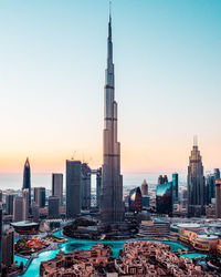 Modern buildings in city at sunset