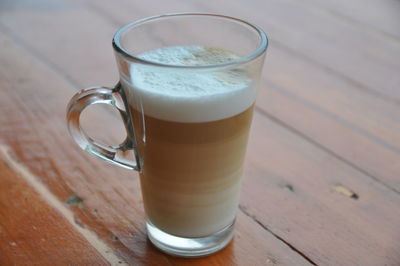 Close-up of coffee on wooden table