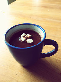 High angle view of coffee cup on table