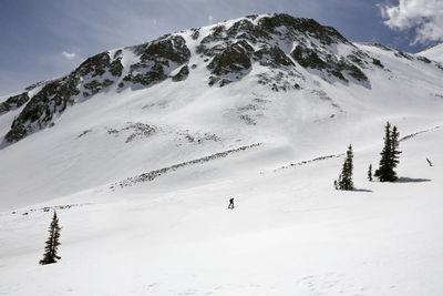 Solo person skis up mount sopris in carbondale, colorado